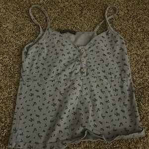 Light blue floral summer top from Brandy M with three buttons in the front.